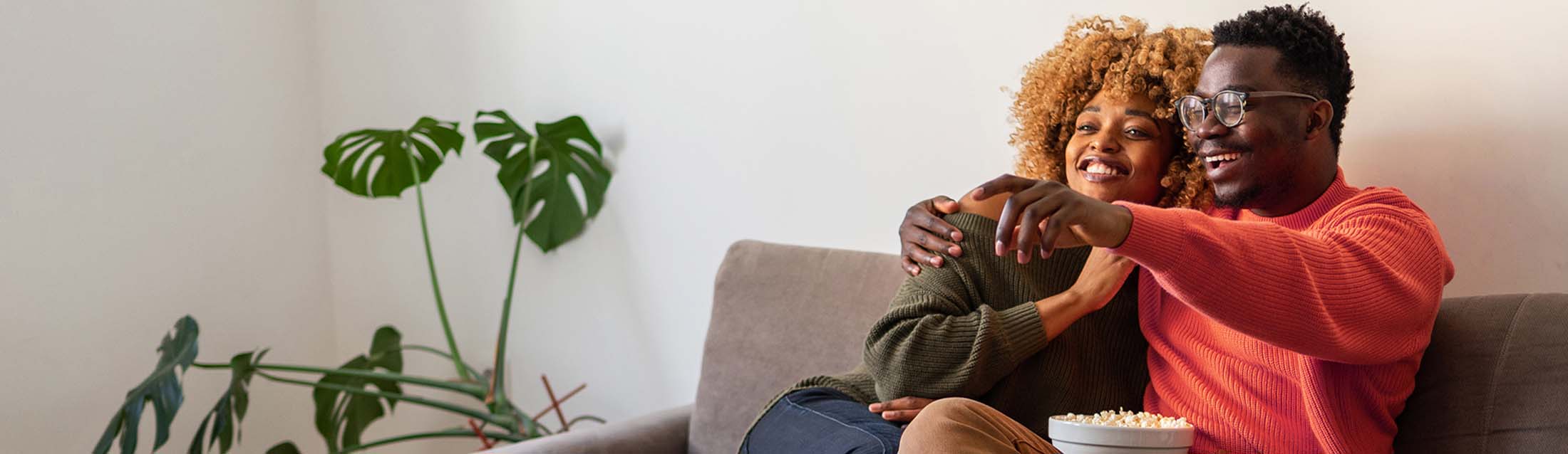 Two people sitting on a couch